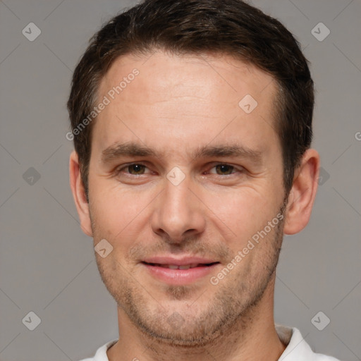 Joyful white young-adult male with short  brown hair and brown eyes