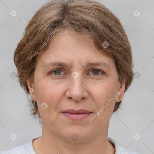 Joyful white adult female with short  brown hair and grey eyes