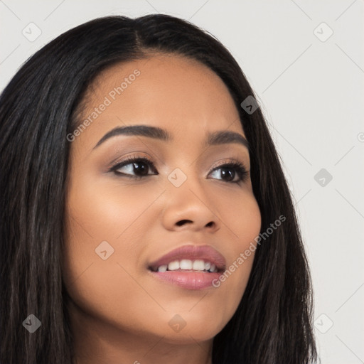 Joyful latino young-adult female with long  brown hair and brown eyes