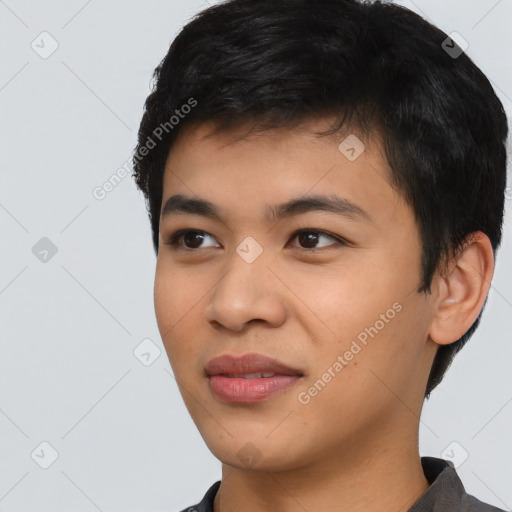 Joyful asian young-adult male with short  black hair and brown eyes