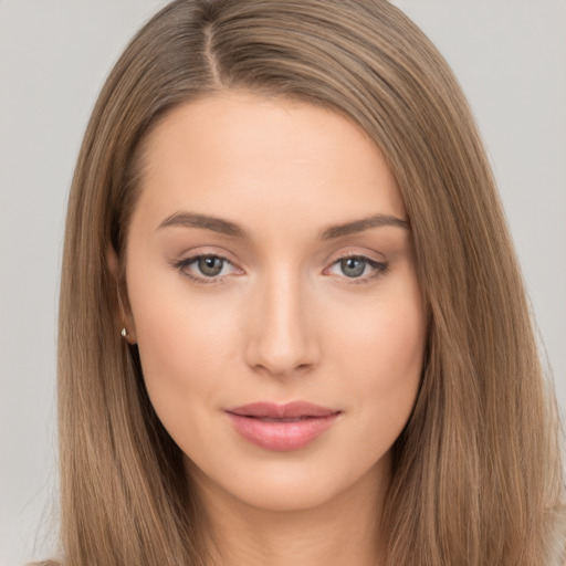 Neutral white young-adult female with long  brown hair and brown eyes