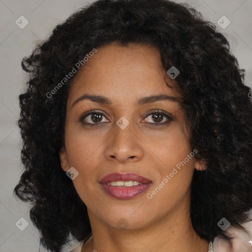 Joyful black young-adult female with long  brown hair and brown eyes