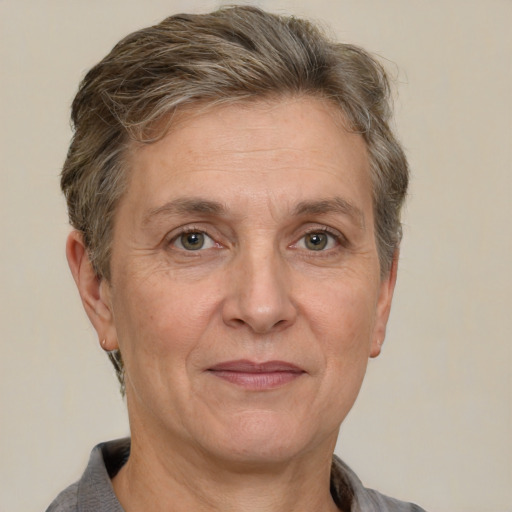 Joyful white middle-aged female with short  brown hair and grey eyes