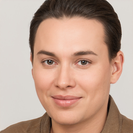 Joyful white young-adult female with short  brown hair and brown eyes