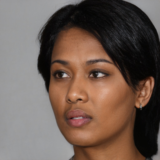 Neutral asian young-adult female with medium  black hair and brown eyes