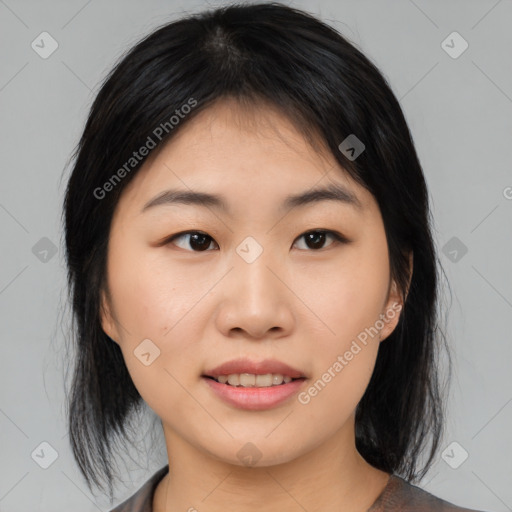 Joyful asian young-adult female with medium  black hair and brown eyes