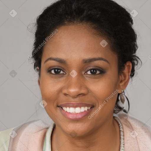 Joyful black young-adult female with long  brown hair and brown eyes