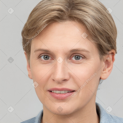 Joyful white adult female with short  brown hair and grey eyes