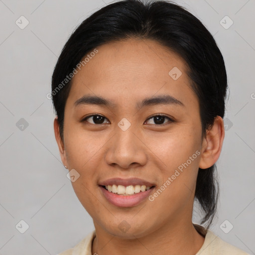 Joyful asian young-adult female with short  brown hair and brown eyes