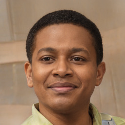 Joyful latino young-adult male with short  brown hair and brown eyes