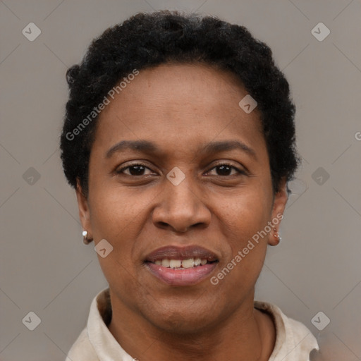 Joyful black adult female with short  brown hair and brown eyes