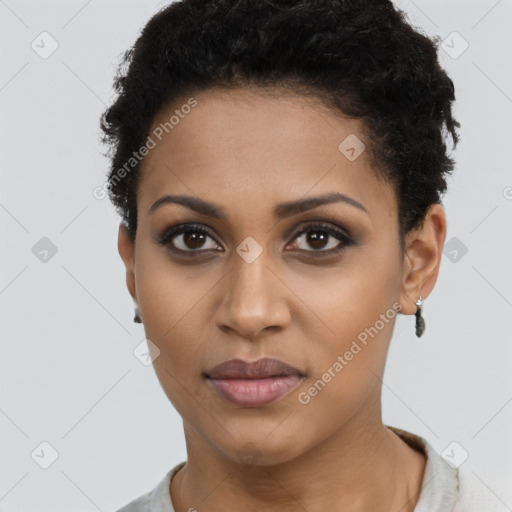 Joyful black young-adult female with short  brown hair and brown eyes