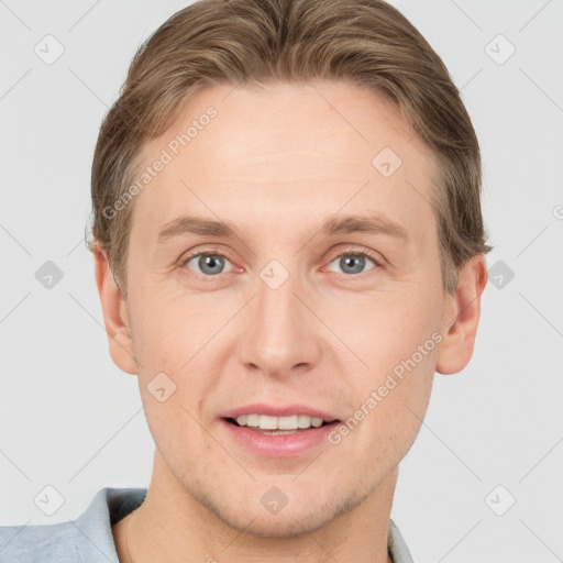 Joyful white young-adult male with short  brown hair and grey eyes