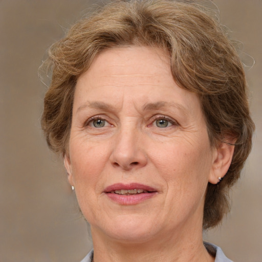 Joyful white middle-aged female with medium  brown hair and brown eyes