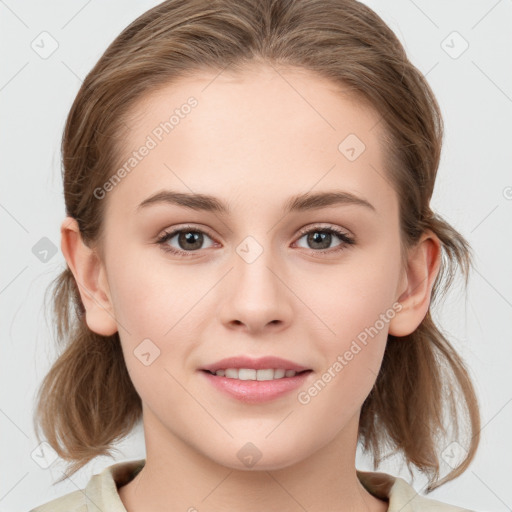 Joyful white young-adult female with medium  brown hair and grey eyes