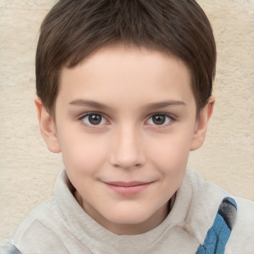 Joyful white child male with short  brown hair and brown eyes