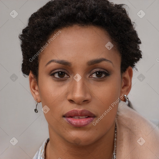 Joyful black young-adult female with short  brown hair and brown eyes