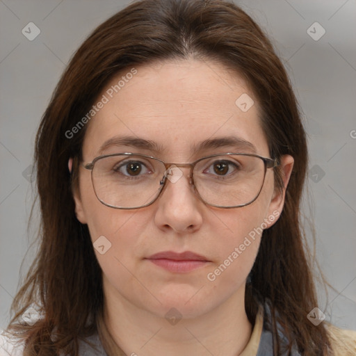 Joyful white adult female with long  brown hair and brown eyes