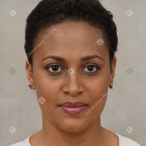 Joyful black young-adult female with short  brown hair and brown eyes