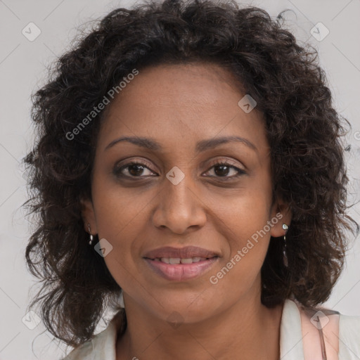 Joyful black adult female with medium  brown hair and brown eyes