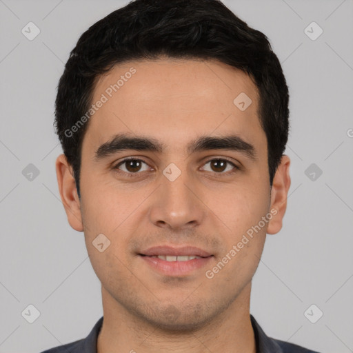 Joyful white young-adult male with short  black hair and brown eyes