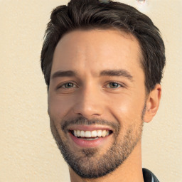 Joyful white young-adult male with short  black hair and brown eyes