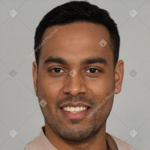 Joyful black young-adult male with short  black hair and brown eyes