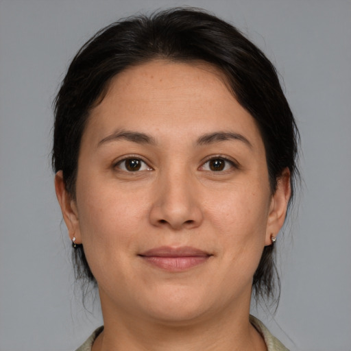 Joyful white young-adult female with medium  brown hair and brown eyes