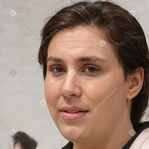 Joyful white adult female with medium  brown hair and brown eyes