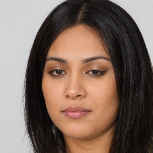 Neutral latino young-adult female with long  black hair and brown eyes