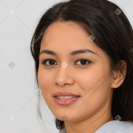 Joyful asian young-adult female with long  brown hair and brown eyes