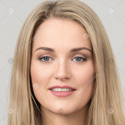 Joyful white young-adult female with long  brown hair and green eyes