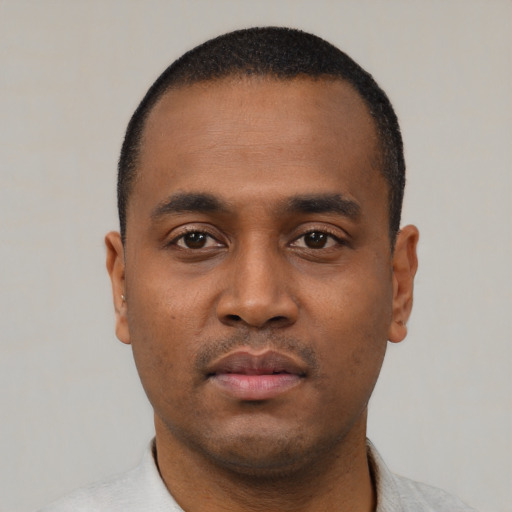 Neutral black young-adult male with short  black hair and brown eyes