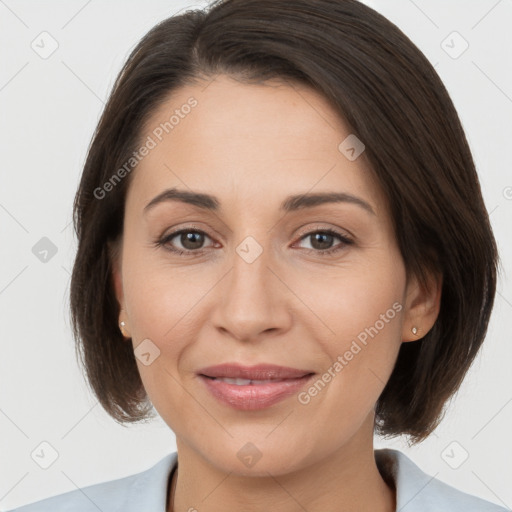 Joyful white adult female with medium  brown hair and brown eyes