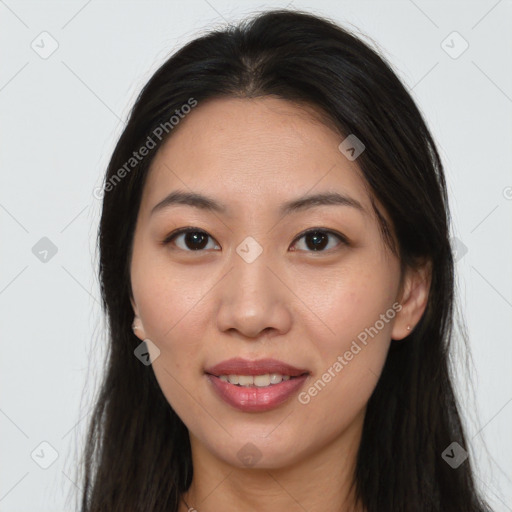 Joyful asian young-adult female with long  brown hair and brown eyes