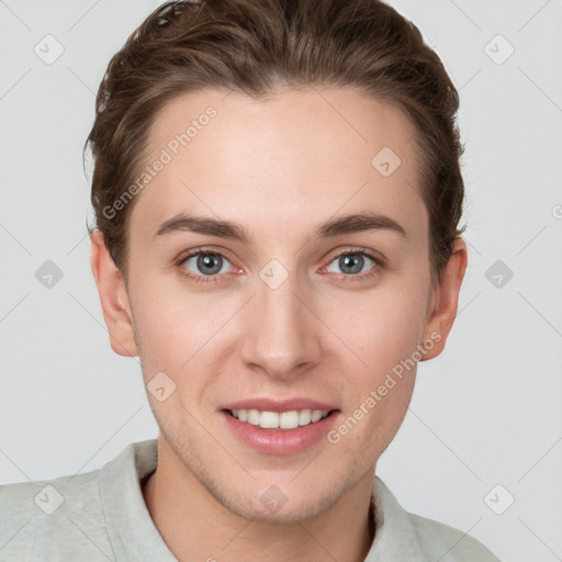 Joyful white young-adult female with short  brown hair and grey eyes