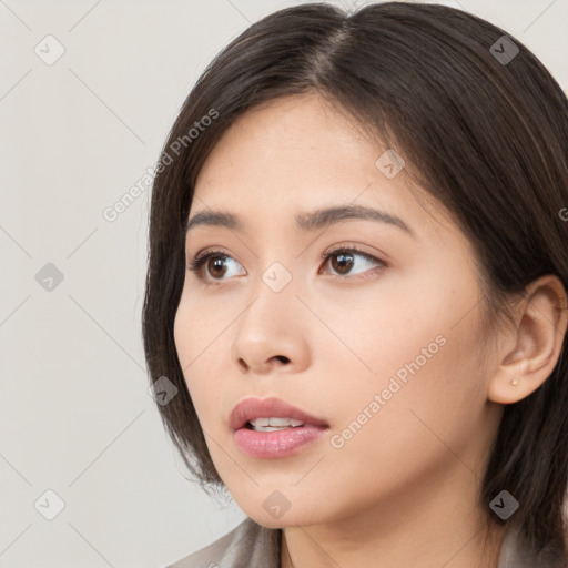 Neutral white young-adult female with long  brown hair and brown eyes