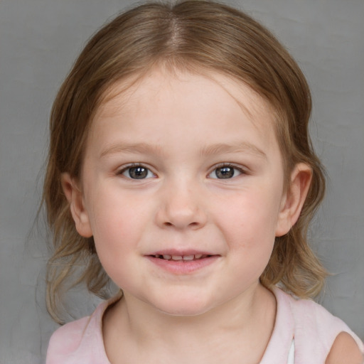 Joyful white child female with medium  brown hair and blue eyes