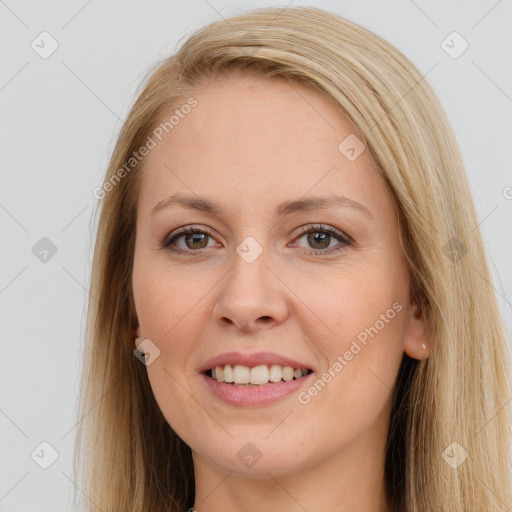 Joyful white young-adult female with long  brown hair and brown eyes