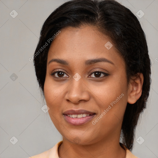 Joyful latino young-adult female with medium  brown hair and brown eyes