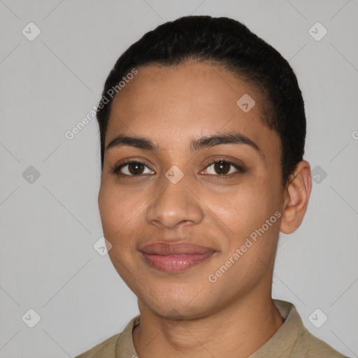 Joyful latino young-adult female with short  black hair and brown eyes