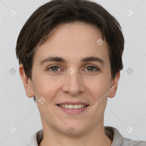 Joyful white young-adult female with short  brown hair and grey eyes