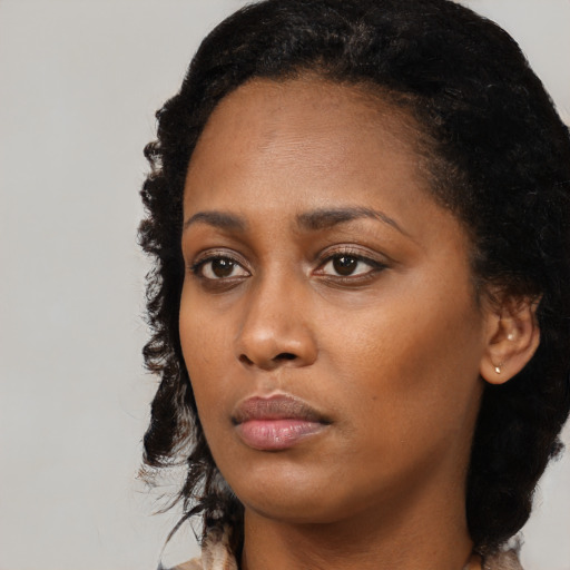 Neutral black young-adult female with long  black hair and brown eyes