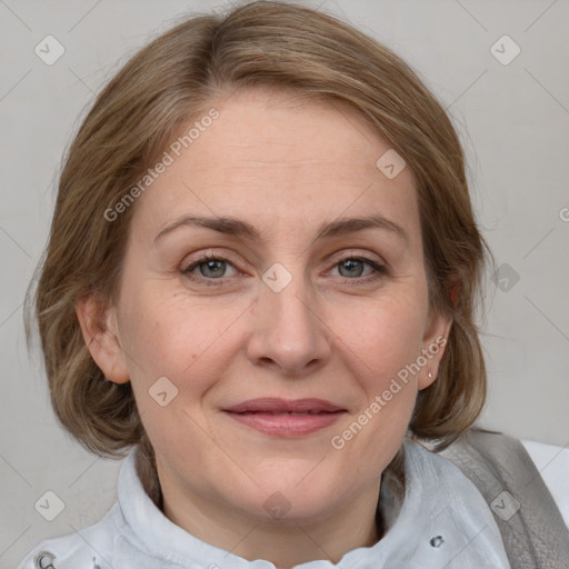 Joyful white adult female with medium  brown hair and blue eyes