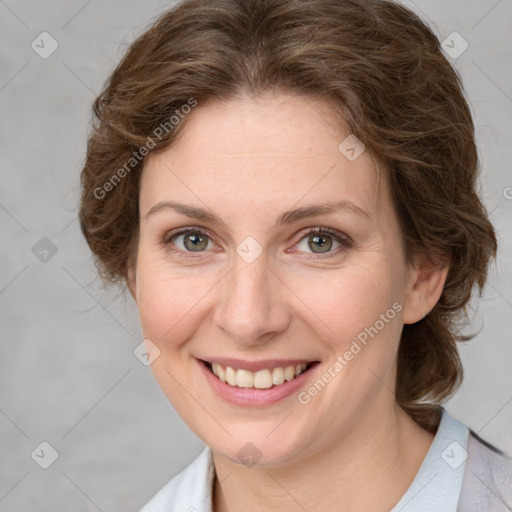 Joyful white young-adult female with medium  brown hair and green eyes