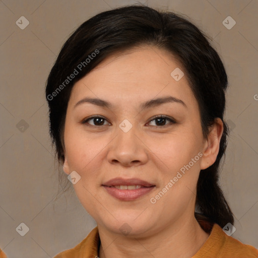 Joyful latino adult female with medium  brown hair and brown eyes