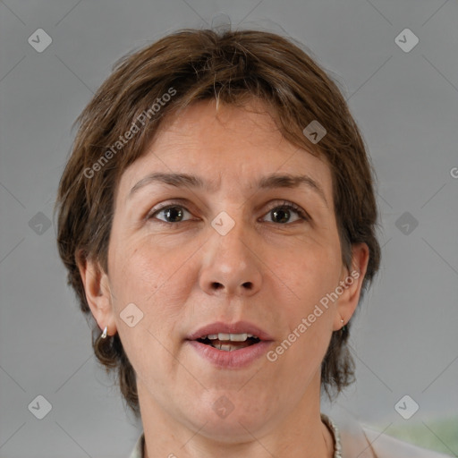 Joyful white adult female with medium  brown hair and grey eyes