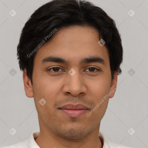 Joyful latino young-adult male with short  brown hair and brown eyes