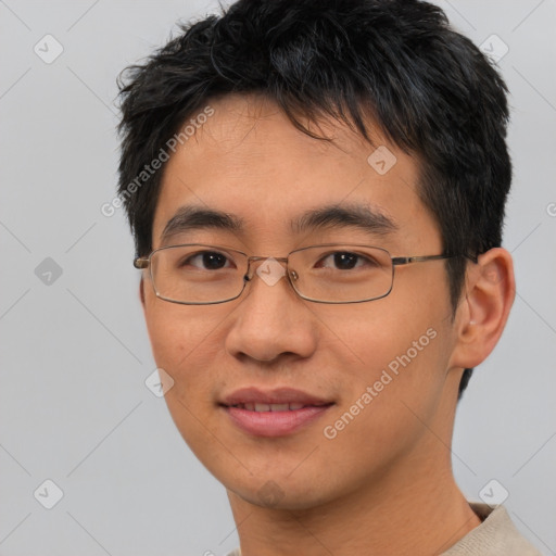 Joyful asian young-adult male with short  brown hair and brown eyes