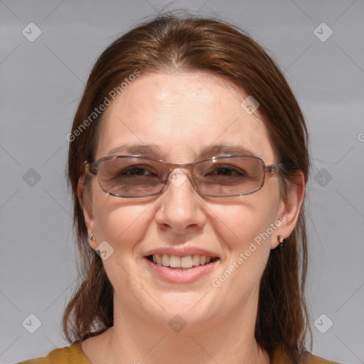 Joyful white adult female with medium  brown hair and brown eyes